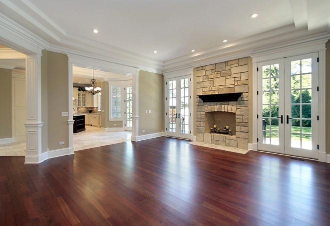 brightly lit room with shiny hardwood flooring